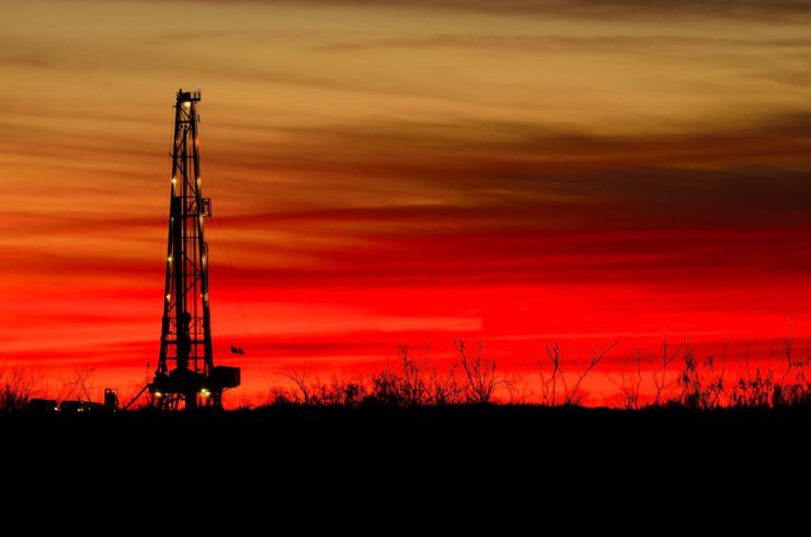 onshore oil and gas against a red sky